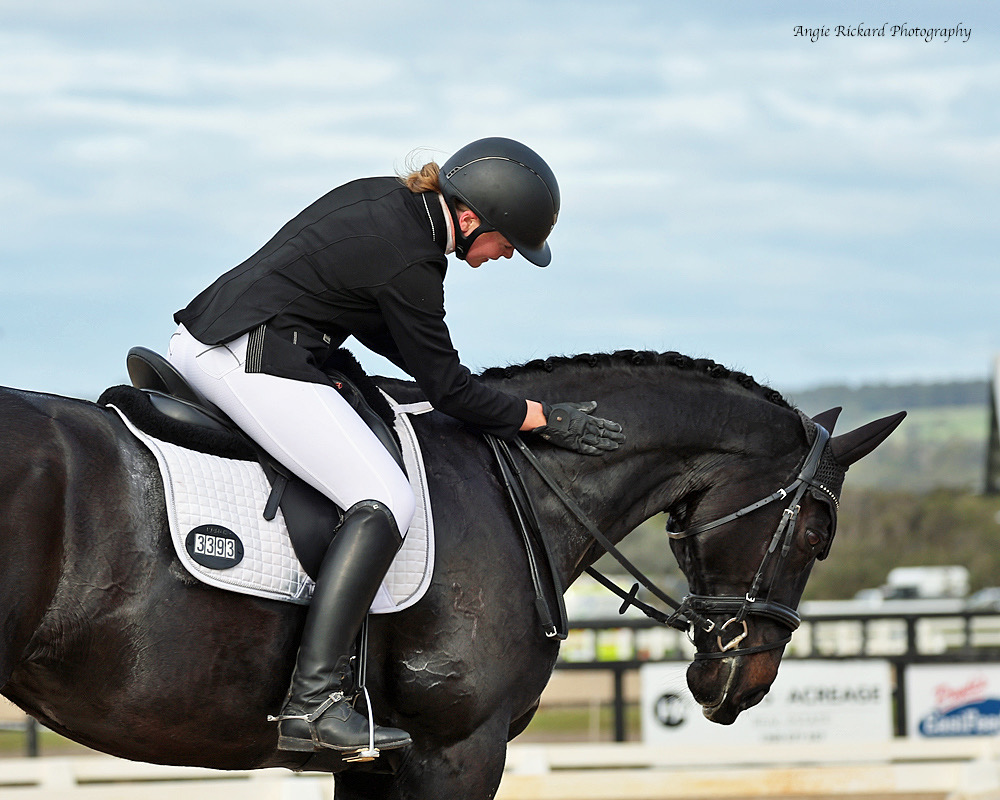 Sponsored Rider Abby Plant patting her horse competition mindset exercise